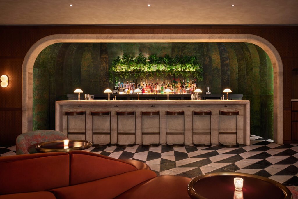 a hotel bar with a black and white floor
