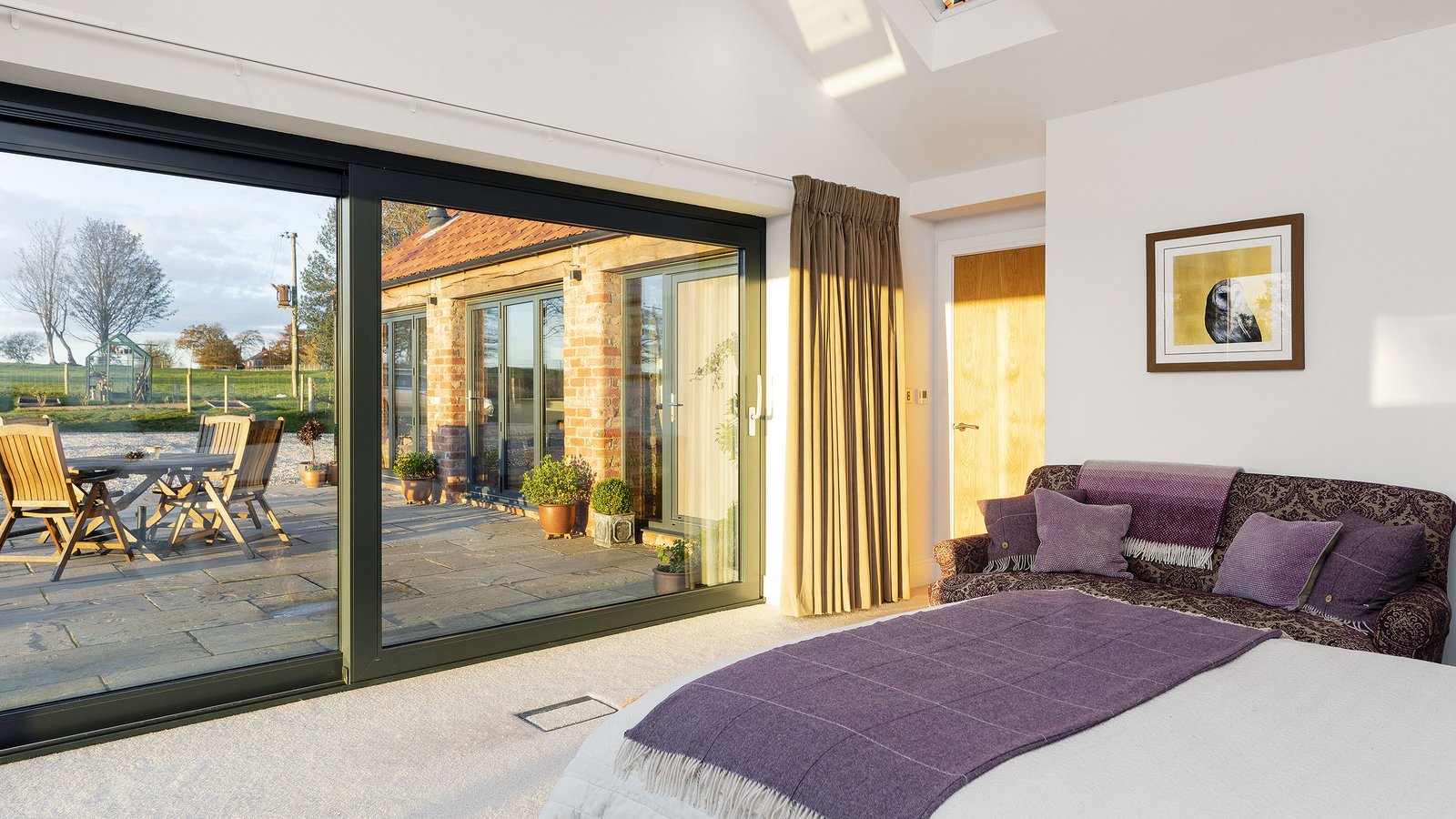 ground floor bedroom with sliding doors to patio