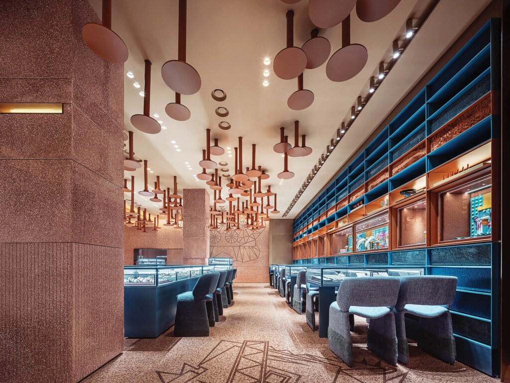 blue seating and matching displays showcase jewelry at this boutique