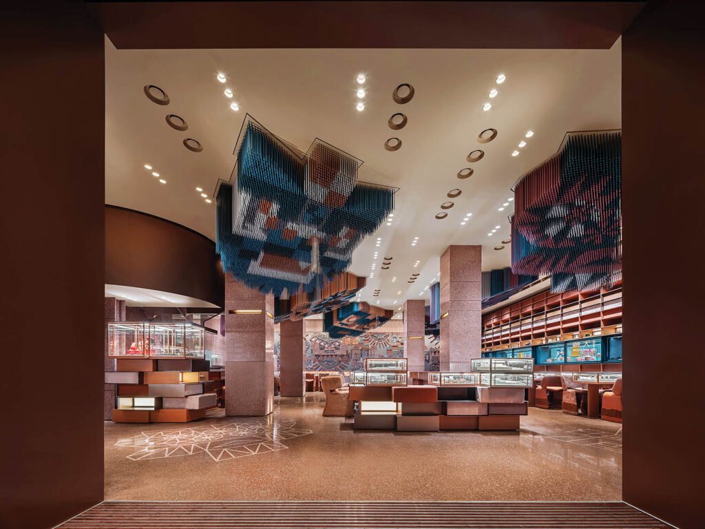 a jewelry store with ceiling installations of metal strips in a pointillist pattern that form jungle animals