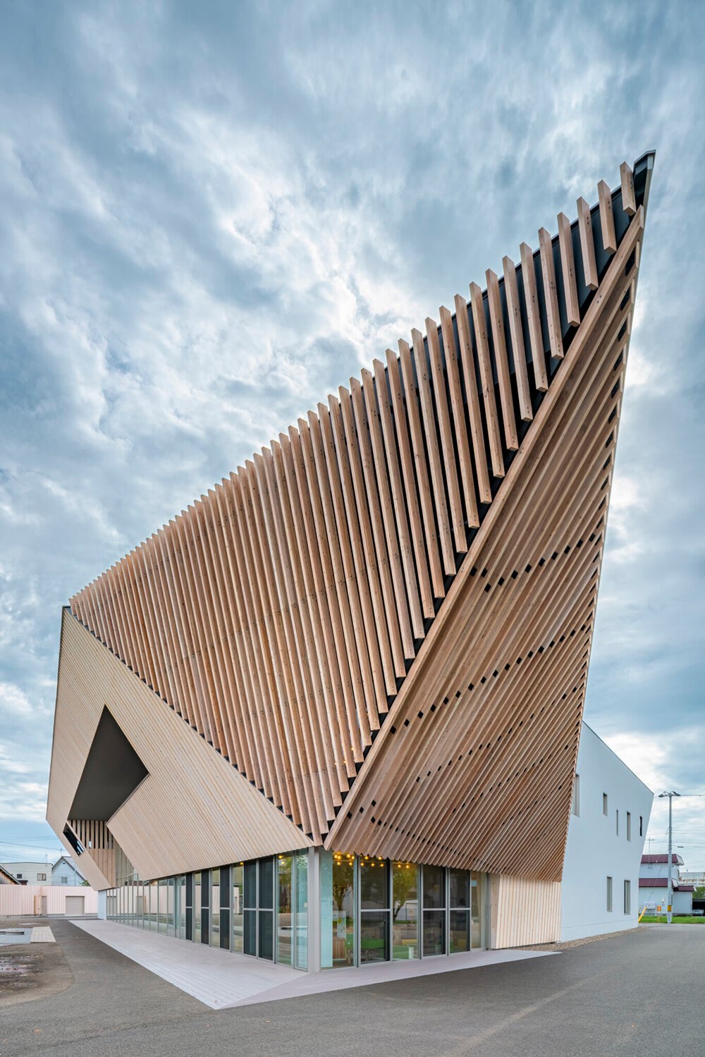 kengo kuma sculpts tessellated wooden eaves for higashikawa community plaza in japan