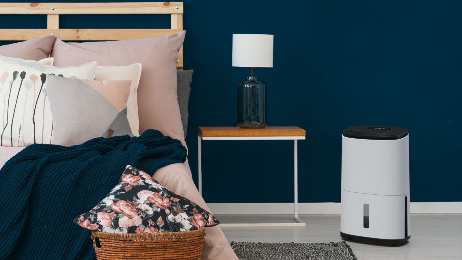 Dehumidifier in bedroom next to bed