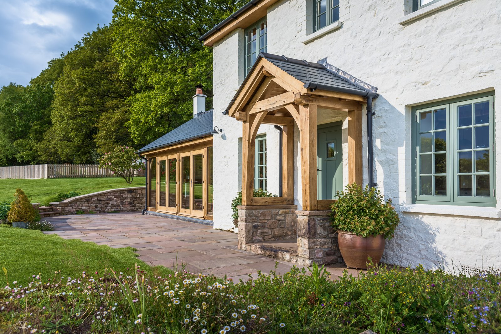oak frame porch extension to white cottage