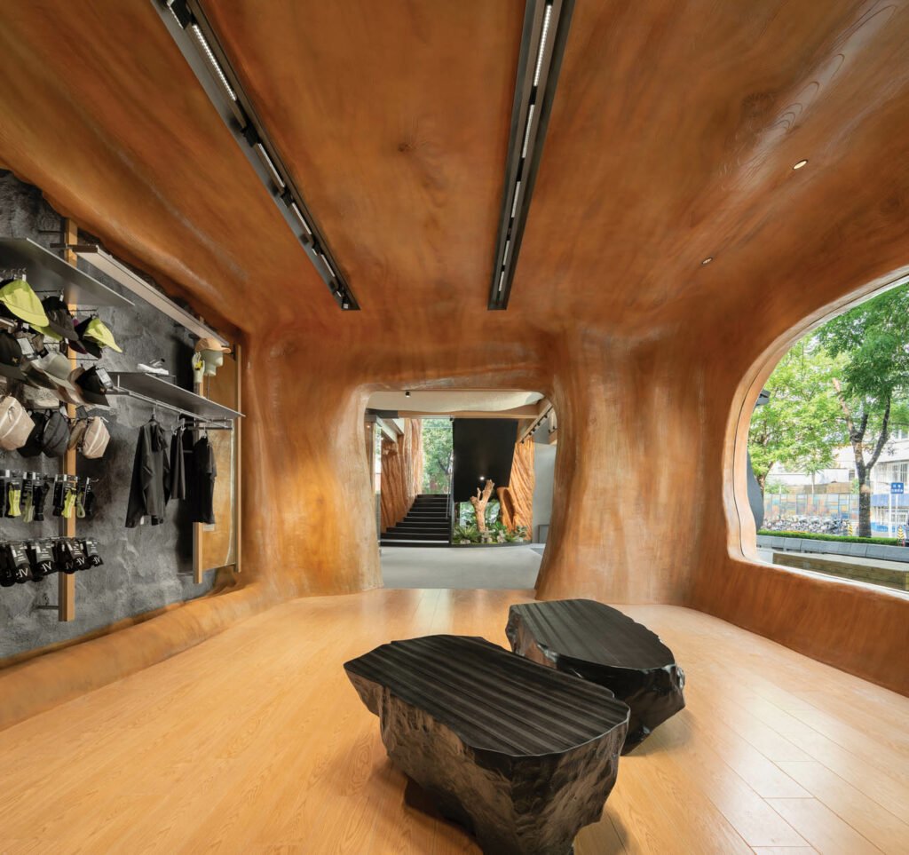a wood-like surface covers the floor, ceiling, and walls in this room at an outdoor apparel brand's store