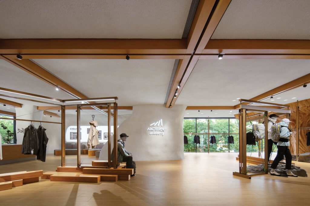 outdoor apparel on display in a wood-accented room