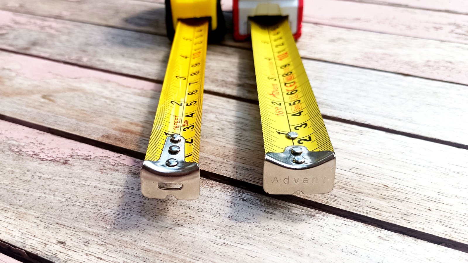 Close up of the end of two tape measures