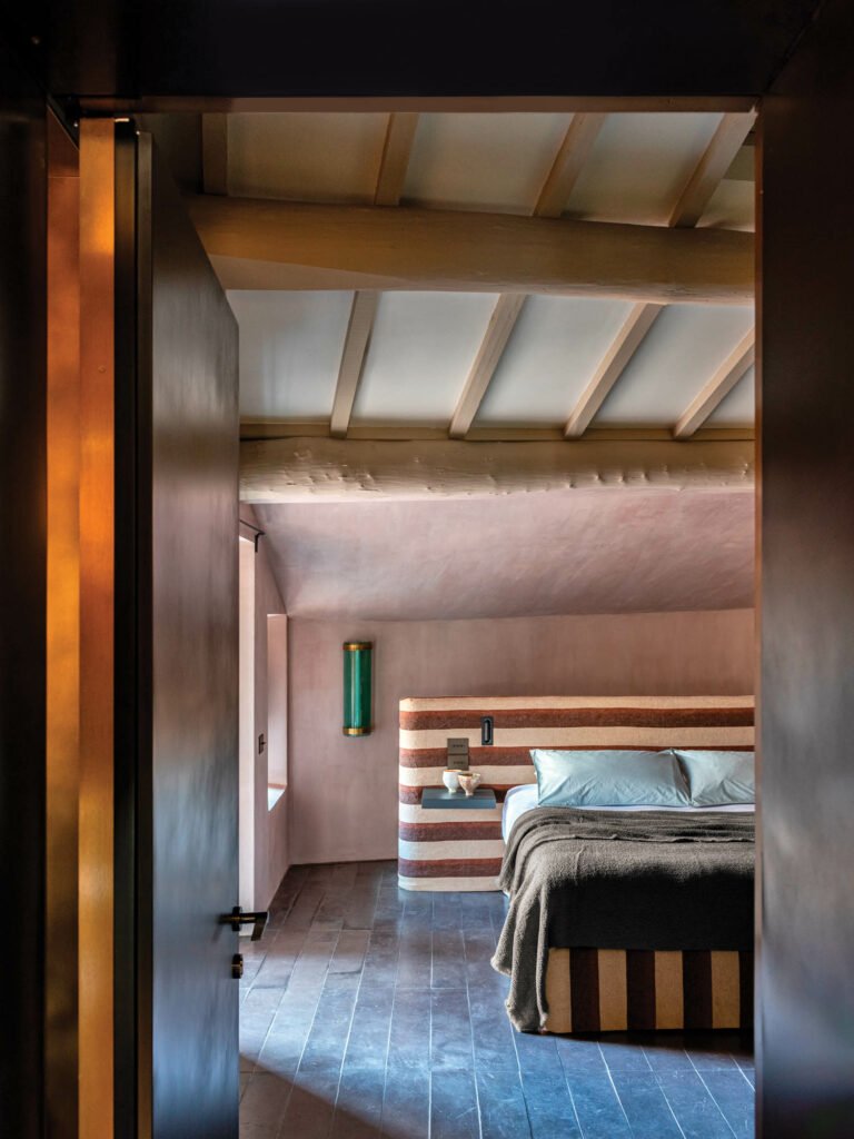 bedroom with wooden floors and high ceilings