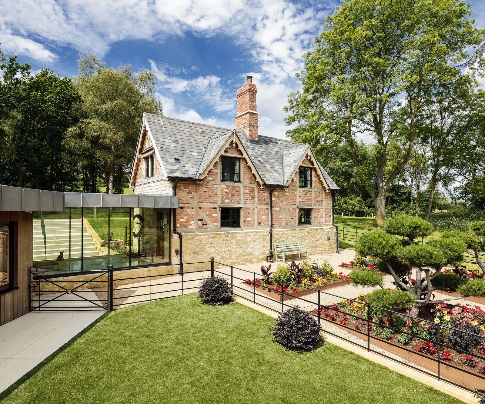 A moden extension on a country home with a parterre garden