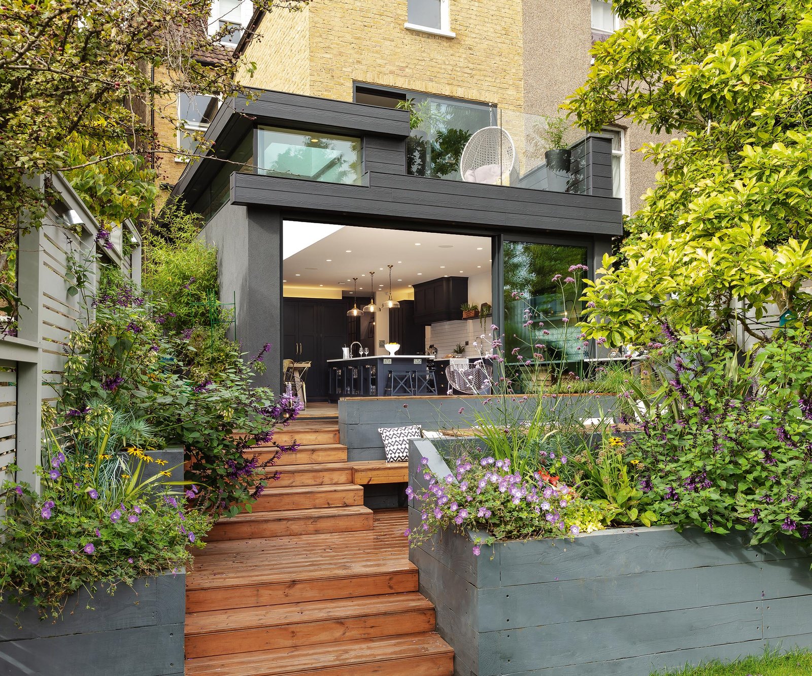 A tiered back garden with modern extension and decking