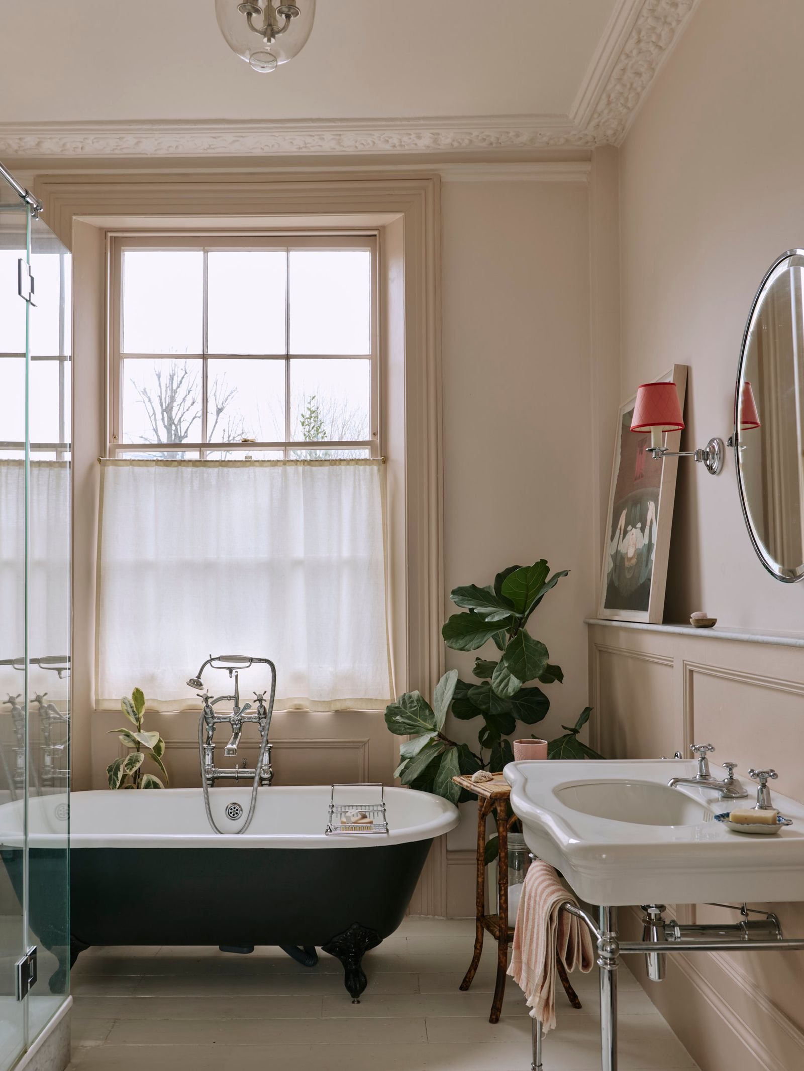 Image may contain Bathing Bathtub Person Tub Sink Lamp and Window