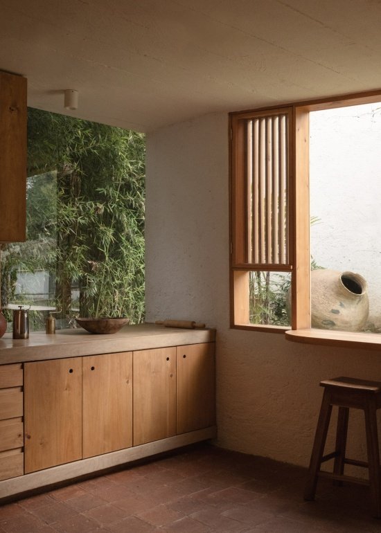 windows and timber cabinetry at the kitchen corner