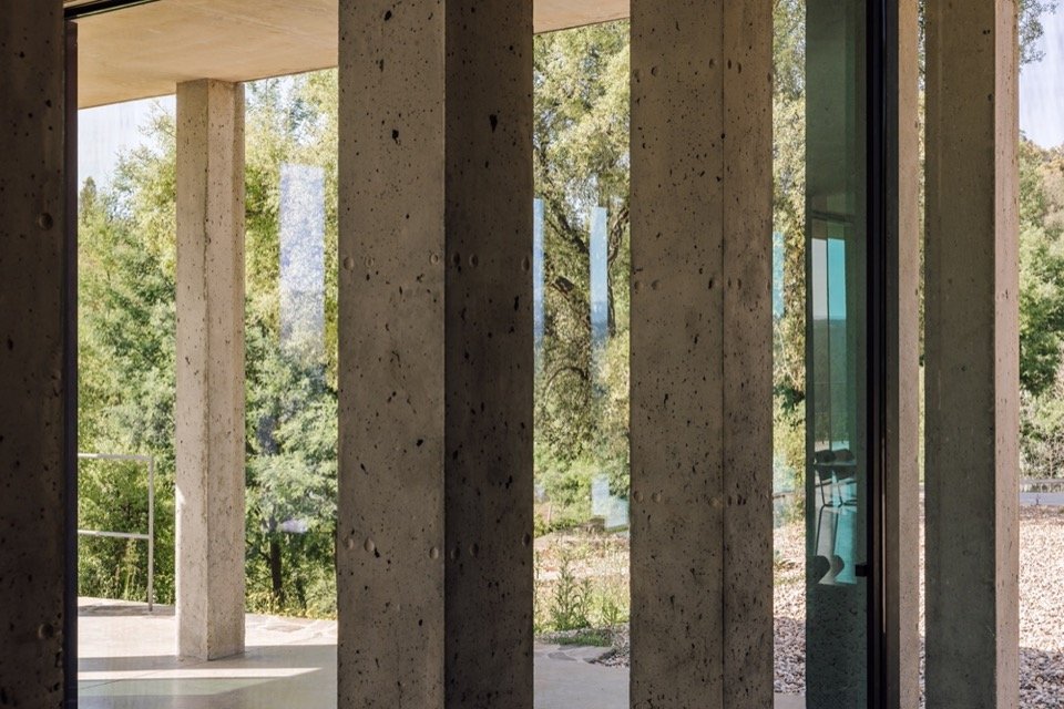 concrete columns and glazed enclosure/concrete columns and glazed enclosure