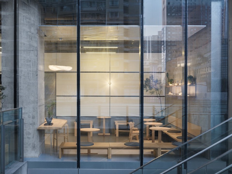 View of indoor seating from outside the glass curtain wall