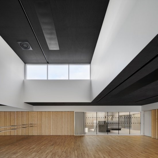 High windows illuminate the dance space, High windows illuminate the dance space