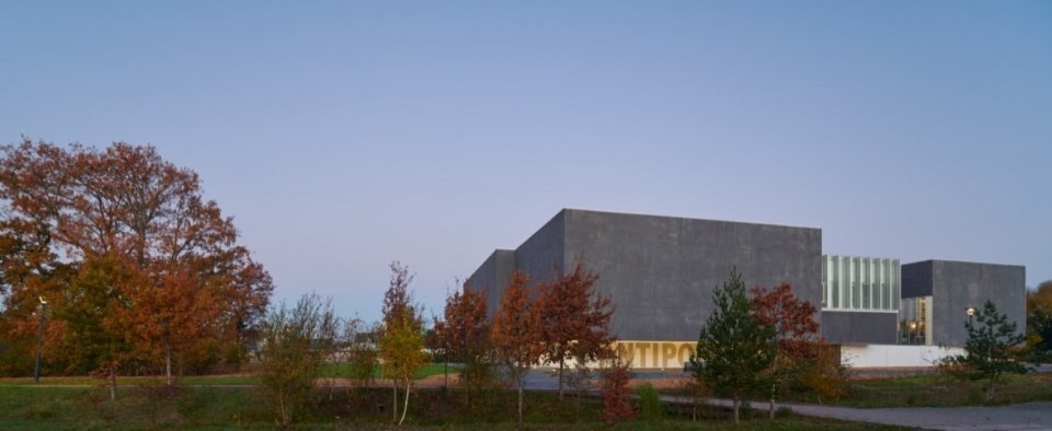 The building within its wooded setting
