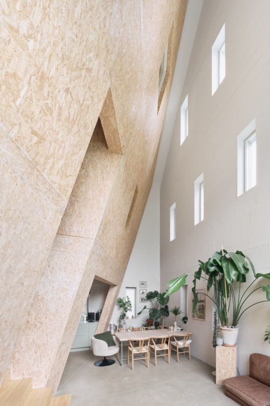 Timber inner façade and triple-height space/ Timber inner façade and triple-height space