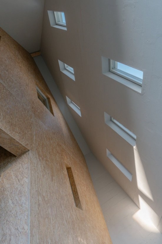Daylight moving along the inclined timber wall