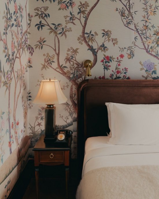 Bedroom with pale floral wallpaper/Bedroom with pale floral wallpaper