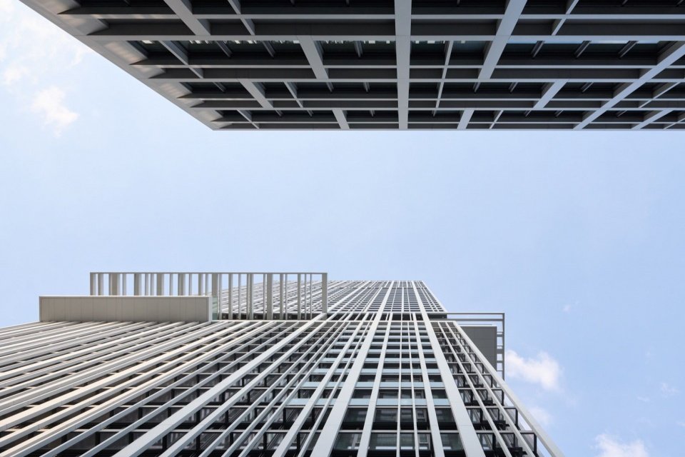 looking up at the gridded façade